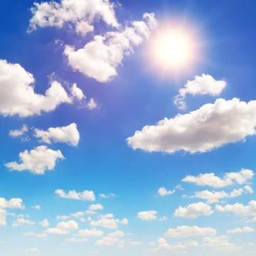 Sun on blue sky with white clouds Stock Photos
