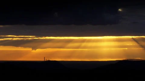 Sun breaking though clouds causing spectacular colours Stock Footage 49044102