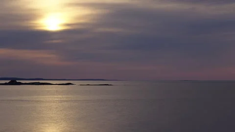 Sun Breaking Through Clouds Over Ocean and Coastal Rocks, 120fps Stock Footage 310534846