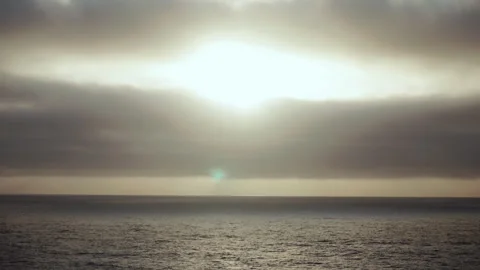Sun breaking through clouds over the Pacific Ocean Stock-Footage 347826453