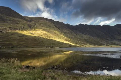 Sun breaking through the clouds Stock-Fotos