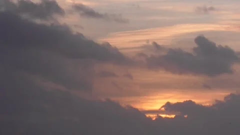 Sun Breaking Through Clouds at Sunrise or Sunset - Time-Lapse Stock Footage