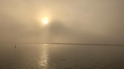 Sun Breaking Through The Morning Mist Over Tranquil Water Stock Footage 128718385