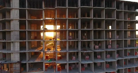 The sun breaking through the unfinished floors of a residential building 스톡 동영상 169412266