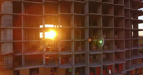 The sun breaking through the unfinished floors of a residential building 스톡 동영상 169412396