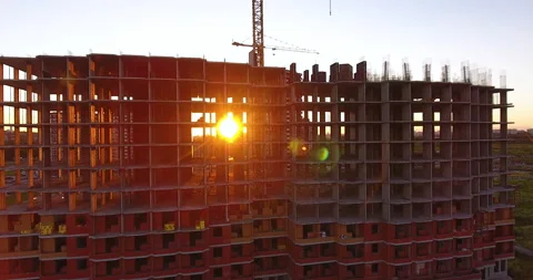 The sun breaking through the unfinished floors of a residential building 스톡 동영상 169414928