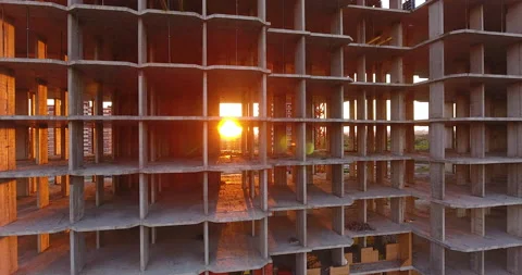 The sun breaking through the unfinished floors of a residential building 스톡 동영상 169415037