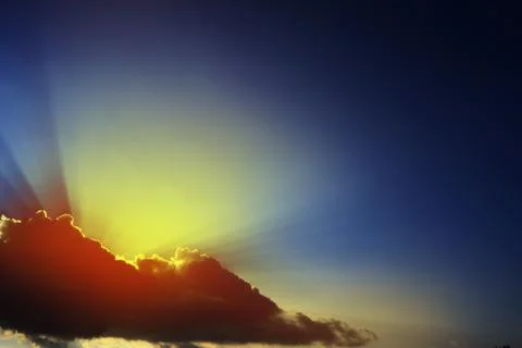 The sun breaking through white clouds. Stock Photos