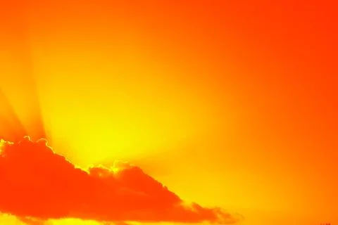 The sun breaking through white clouds. Stock Photos
