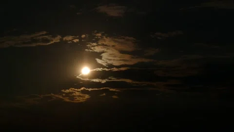 The sun  breaks its rays through the floating dark clouds Stock Footage 273588648