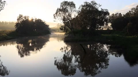 Sun breaks over Macquarie river in Dubbo as 4k time lapse nature. Stock Footage 141472535