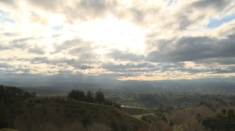 Sun breaks through clouds timelapse Stock Footage 8763295