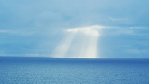 Sun breaks through the clous on the sea Stockbeeldmateriaal 97446223