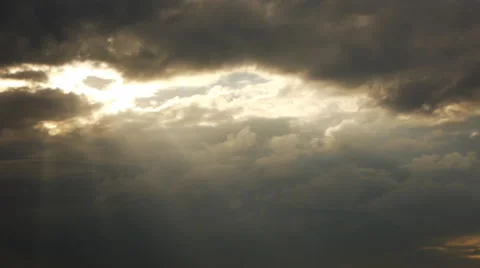 The sun breaks through the dark clouds. Stock Footage