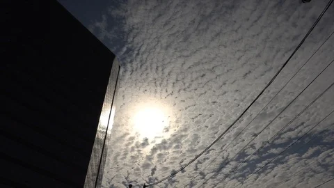 Sun building and mackerel sky with clouds Stock Footage 112637771