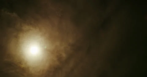 Sun burning through an overcast sky of thickening altocumulus clouds. Stock Footage 345453264