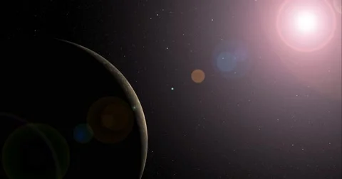 The sun bursts into view over Callisto's horizon and illuminates the surface. Stock-Footage 63798818