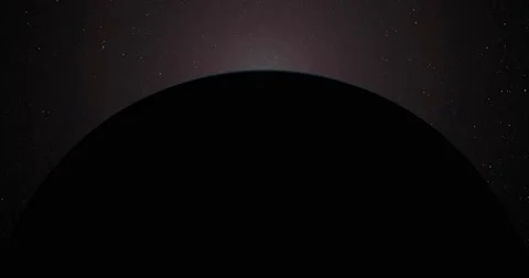 The sun bursts into view over Uranus' horizon and illuminates the surface.  Stock Footage 63802207