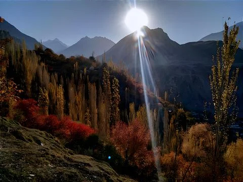 Sun is casting a bright light over a rugged mountain range Stock Photos