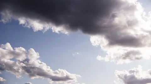 The Sun Casting Its Light Amidst The Clouds Stock Footage 253315461