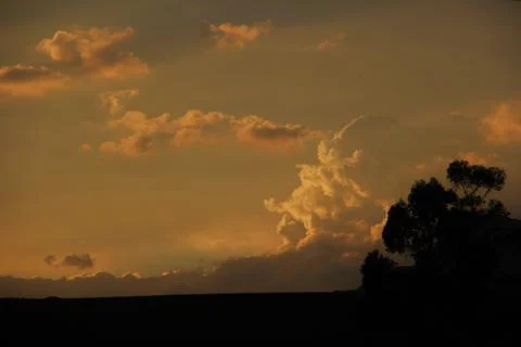 Sun caught in mountain clouds Stock Photos