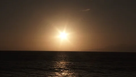 Sun Centered Over Large Body Of Water Video stock 106633259