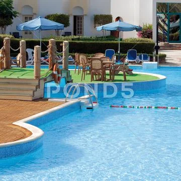 Sun chairs and umbrellas Stock Photos