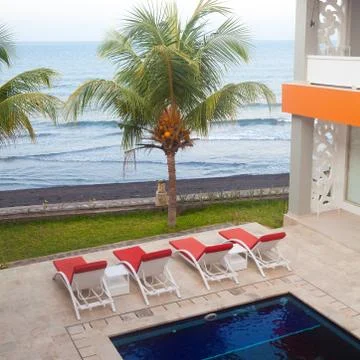 Sun chairs at the pool. Stock Photos