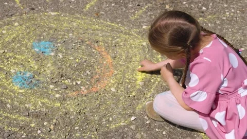 Sun child hand drawing chalk asphalt, child kid childhood dream, little artist Stock Footage 279428106