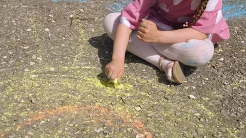 Sun child hand drawing chalk asphalt, child kid childhood dream, little artist Stock Footage 279890271