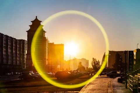 Sun circle effect in gold sunrise at the sreets of Nur-Sultan  Astana. Nur-Su Stock Photos