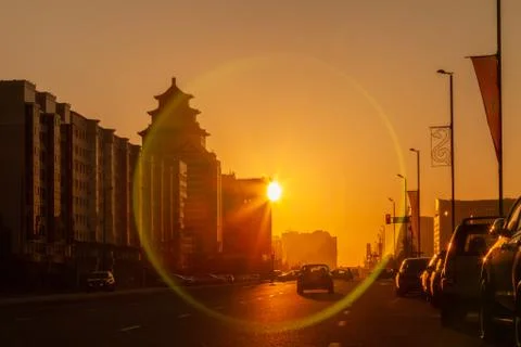 Sun circle effect  in gold sunrise at the sreets of Nur-Sultan  Astana. Nur-S Stock Photos