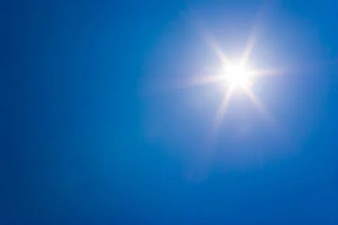 Sun at clear blue sky Stock Photos