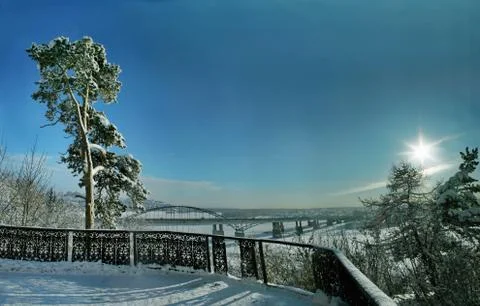 The sun in the clear winter sky at sunset Stock Photos
