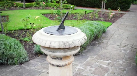 Sun Clock Pan Around in the Garden Background Stock Footage 54361262