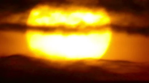 Sun close up in  clouds Stock Footage 44551780