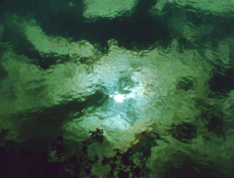 Sun with clouds + tree reflections in mystical water, vintage, Super 8 film 動画素材 280440998