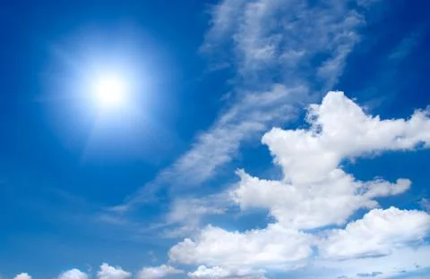 Sun in the cloudy sky Stock Photos