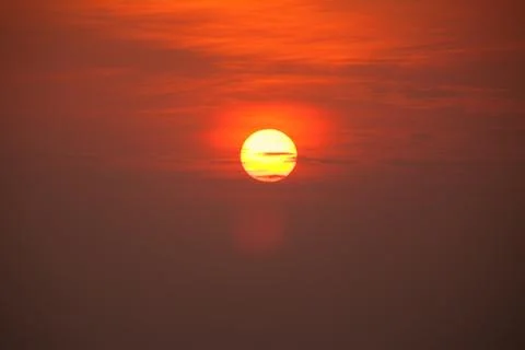 Sun with cloudy sky at sunset Stock Photos