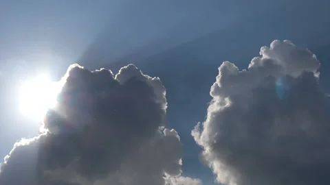 The sun comes out from behind the clouds and shines brightly Stock Footage 89892714