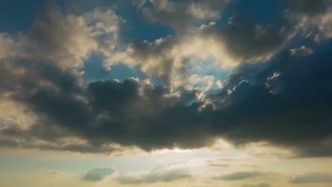 Sun comes out from grey clouds. Professional 4k time lapse, no birds, no flicker Stock Footage 104154232