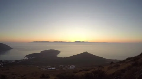 Sun comes out in Molos beach. Paros island Greece. Time Lapse Stock Footage 240709706