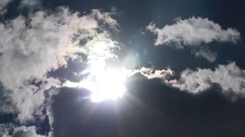 The sun coming out from behind a cloud Stock Footage 50077065