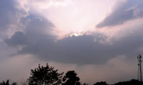 Sun coming out from the clouds Stock Photos