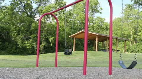 Sun coming up over swing Video stock 729418