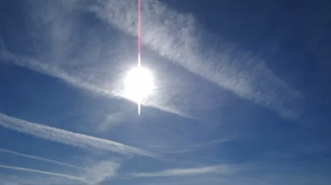 The Sun with con trails and flares, timelapse Stock Footage