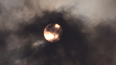 Sun covered by black clouds of smoke Stock Footage 102699596