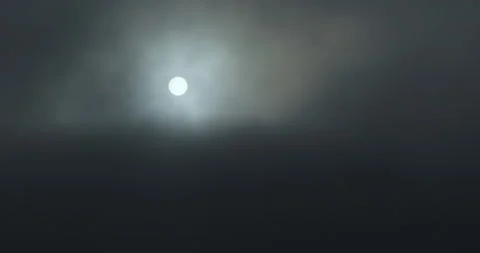 Sun covered by black clouds of smoke. Sunset over clouds. Smoke, fog. Stock Footage 157285036