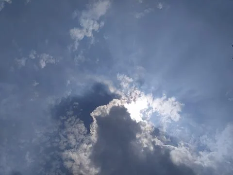 The sun is covered by clouds at noon Stock Photos