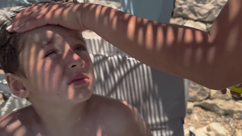 Sun cream concept, Applying sun cream, body milk to children boy in sunny t.. Stock Footage 256244843